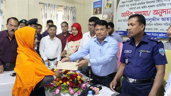 Helaluddin Ahmed, Secretary, Election Commission distributing financial aid among the injured persons of election duty at Lama Upazila Administration Hall Room organised by Upazila Administration and Election Office as Chief Guest on Saturday.