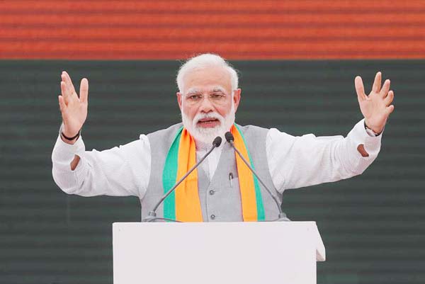 Indian Prime Minister Narendra Modi gestures as he speaks after releasing India's ruling Bharatiya Janata Party (BJP)'s election manifesto for the AprilMay general election, in New Delhi on Monday.