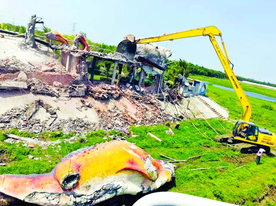 BIWTA demolishing the illegal structures on the bank of Turag River in Birulia area of Mirpur on Tuesday.