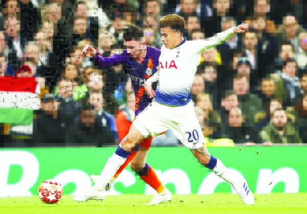Manchester City's Aymeric Laporte (left) challenges for the ball with Tottenham's Dele Alli during the Champions League, round of 8, first-leg soccer match between Tottenham Hotspur and Manchester City at the Tottenham Hotspur stadium in London, Tuesday