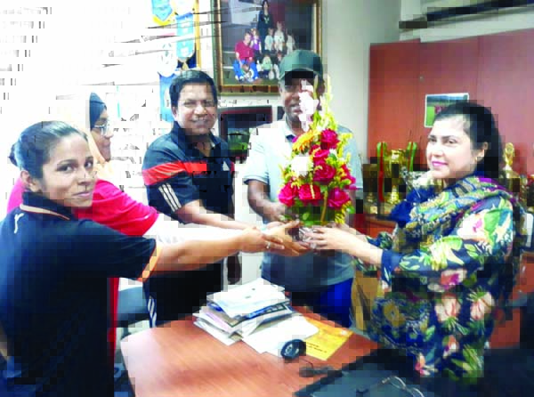 Members of Bangladesh Under-19 National Women's Football team receiving Mahfuza Akter Kiron (right) with floral wreath at Bangladesh Football Federation House on Wednesday. Kiron was reelected female member of the Executive Committee of the Asian Footba