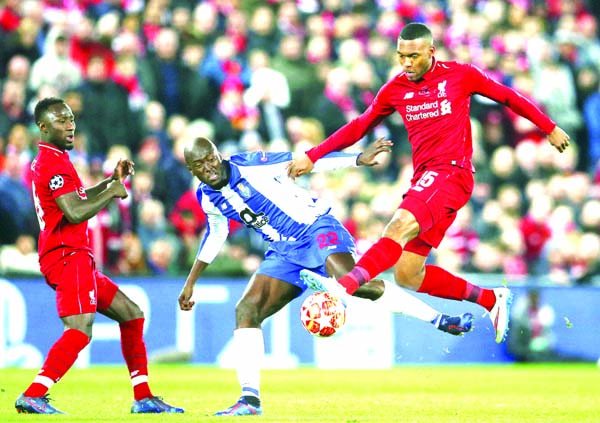 Porto's Danilo vies for the ball with Liverpool's Daniel Sturridge (right) during the Champions League quarterfinal, first leg, soccer match between Liverpool and FC Porto at Anfield Stadium, Liverpool, England on Tuesday.