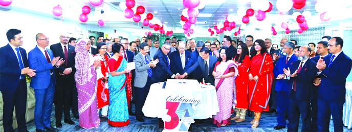 M Morshed Khan, founder Chairman of AB Bank Limited, inaugurating its 37th founding anniversary programme by ccutting cake at the Bank's head office in the city recently. Tarique Afzal, Managing Director (CC), Directors and other senior executives of the