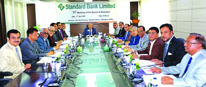 Kazi Akram Uddin Ahmed, Chairman, Board of Directors of Standard Bank Limited, presiding over its 311th meeting at its head office in the city on Thursday. Mamun-Ur-Rashid, Managing Director, Mohammed Shamsul Alam, Vice Chairman, Kamal Mostafa Chowdhury,