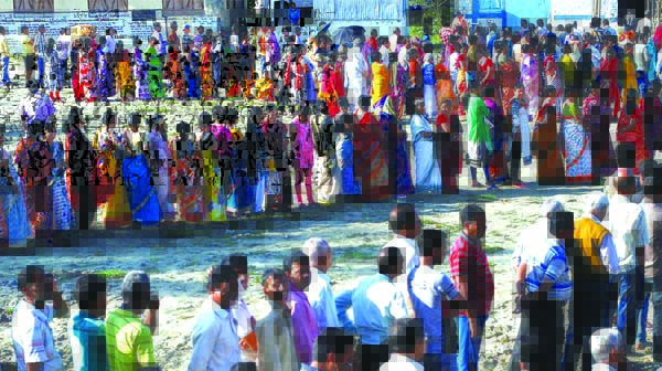 Voters line up to cast their votes outside a polling station during the first phase of general election in Alipurduar district in the eastern state of West Bengal in India on Thursday.
