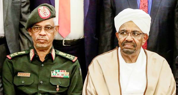 Sudan's military ousted President Omar al-Bashir (right) is seen seated alongside Defense Minister Awad Mohammed Ibn Ouf. AP file photo