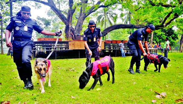 RAB members scanning the premises of Ramna Batamul with its dog squad to beef up security measures on the occasion of Pahela Baishakh. The snap was taken on Friday.