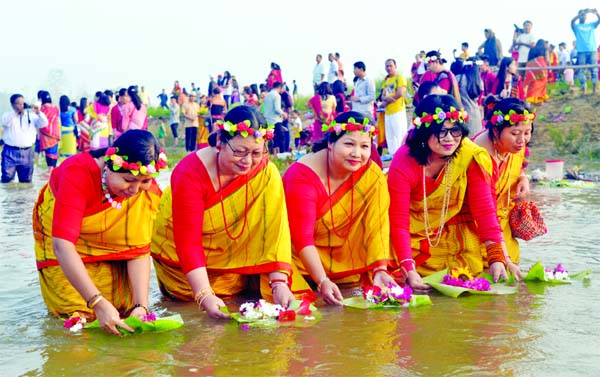 The Chakma women releasing flowers in the river for love and respect to Gangadevi (goddess). This photo was taken from Chengi River in Khagrachhari on Friday.