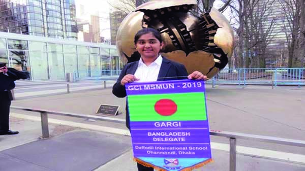 Swastika Gargi Chakraborty poses for photograph with Bangladesh national flag in front of UN Headquarters in New York recently.