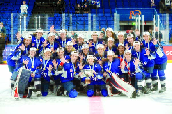 The US team pose with their gold medals during the medal ceremony after their 2-1 shootout victory in the IIHF Women's Ice Hockey World Championships final match between the United States and Finland in Espoo, Finland on Sunday.
