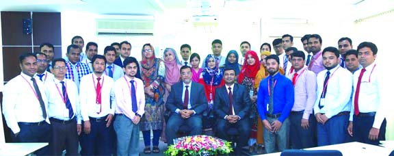 Md. Motaleb Hossain, DMD of Standard Bank Limited, poses for a photograph with the participants of a two days long training course on "Customer Service & Marketing of Bank's Products" for managers (operation), desk-in-charge and desk officers at its Tr