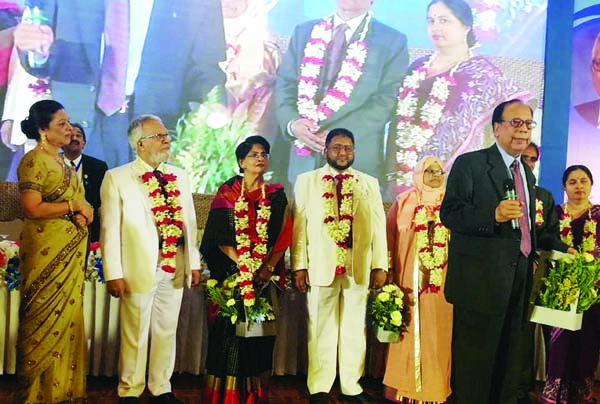 Newly-elected Governor Lion Dr Shahidul Islam, 1st Vice District Governor Lion Nazrul Islam Sikder and Vice Dist Governor-2 Lion Architect Nikhil Chandra Guha being greeted by PID Moslem Ali Khan at the 23rd Annual District Convention of Lions Clubs Inter