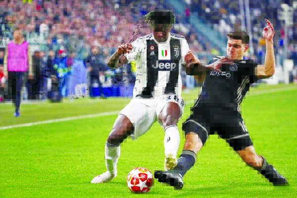 Juventus' Moise Kean (left) and Ajax's Lisandro Magallan fight for the ball during the Champions League quarter final, second leg soccer match between Juventus and Ajax at the Allianz stadium in Turin, Italy on Tuesday.