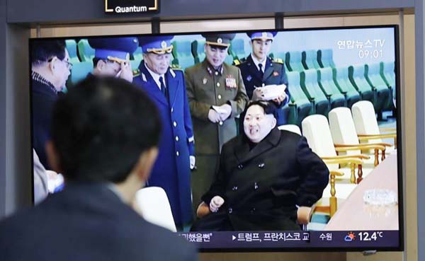 A man watches a TV news program reporting about North Korea's test-fire of a "new-type tactical guided weapon," with a footage of North Korean leader Kim Jong Un, at the Seoul Railway Station in Seoul, South Korea on Thursday.