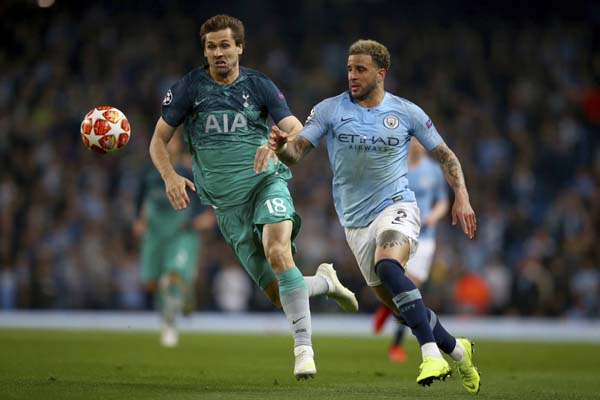 Tottenham's Fernando Llorente (left) and Manchester City's Kyle Walker compete for the ball during the Champions League quarterfinal, second leg, soccer match between Manchester City and Tottenham Hotspur at the Etihad Stadium in Manchester, England on