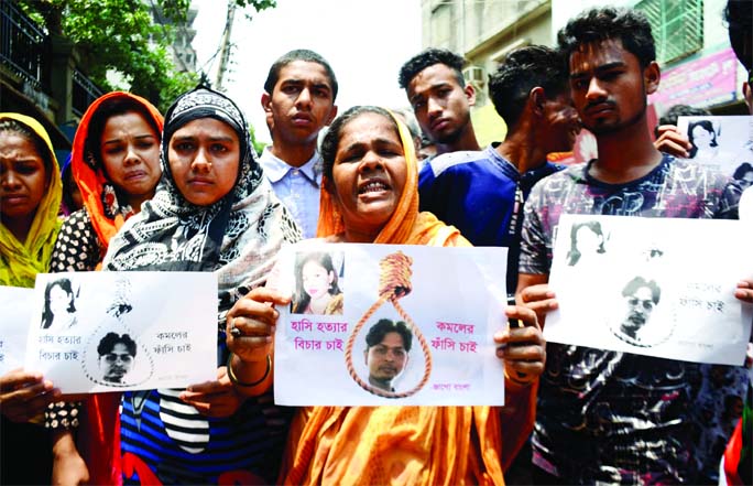 Locals and aggrieved families formed a human chain on Thursday in city's Mugda area, demanding capital punishment to husband for killing his wife.