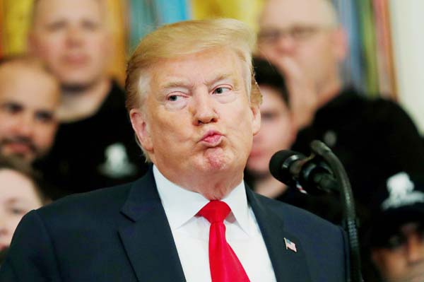 US President Donald Trump reacts as he speaks at the Wounded Warrior Project Soldier Ride event after the release of Special Counsel Robert Mueller's report, in the East Room of the White House in Washington on Thursday.