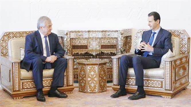 President Bashar al-Assad Â® meeting with Russian diplomat Alexander Lavrentiev in Damascus on Friday.