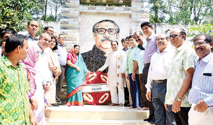 Prof Dr Iftekhar Uddin Chowdhury, VC and Prof Dr Shirin Akter , Pro-VC Chittagong University placing wreaths at the portrait of Father of the Nation Bangabandhu Sheikh Mujibur Rahman on the campus observing the historic Mujibnagar Day on Wednesday.