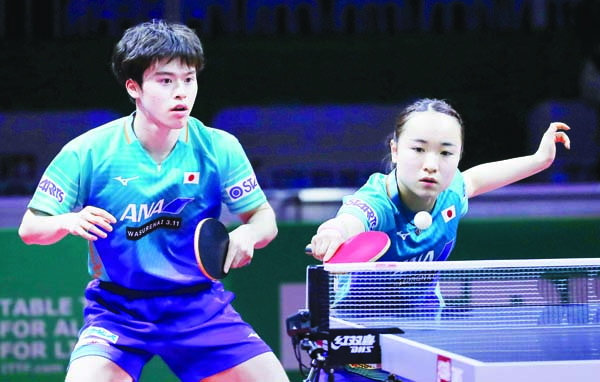 Masataka Morizono (left) and Mima Ito of Japan play against Kutbidillo Teshaboev and Rozalina Khadijev of Uzbekistan during their mixed doubles qualifying match of the World Table Tennis Championships in Budapest, Hungary on Monday.