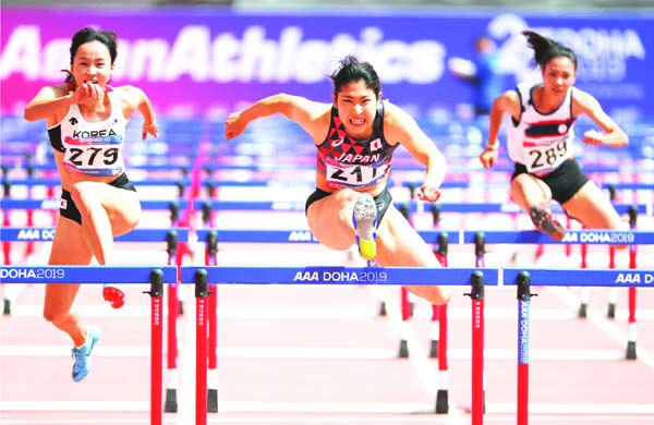 (From left to right) Jung Hyelim of South Korea, Masumi Aoki of Japan, Manevanh Chanthavong of Laos compete during the women's 100m Hurdles round 1 at the Asian Athletics Championships in Doha, Qatar on Tuesday.