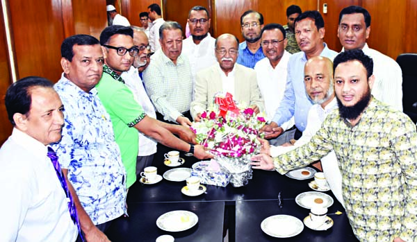 President of Bangladesh Salt Owners Association Nurul Kabir along with other members of the association greeted Industries Minister Nurul Mazid Mahmud Humayun with bouquet after holding a meeting with minister at the seminar room of the ministry on Tuesda