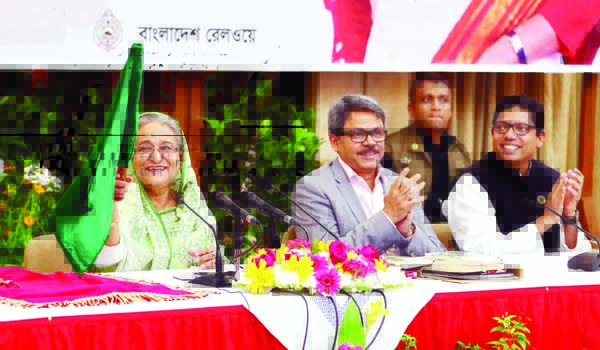 Prime Minister Sheikh Hasina inaugurated non-stop inter-city train in Rajshahi-Dhaka-Rajshahi route waving flag through video conferencing at Ganobhaban on Thursday. BSS photo