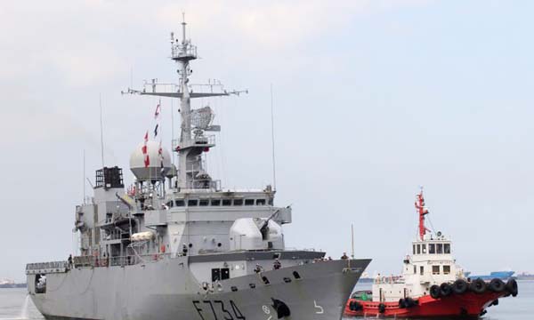 Tugboat escorts French Navy frigate Vendemiaire on arrival for a 5-day goodwill visit at a port in Metro Manila, Philippines.