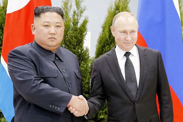 Russian President Vladimir Putin, (right), and North Korea's leader Kim Jong Un shake hands during their meeting in Vladivostok, Russia on Thursday.