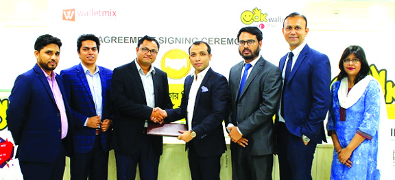 Gazi Yar Mohammed, EVP of ONE Bank Limited and Md. Humayun Kabir, Managing Director of Walletmix, exchanging an agreement signing document at the Bank's head office in the city recently. Under the deal, OK Wallet customers of the Bank will able to purcha