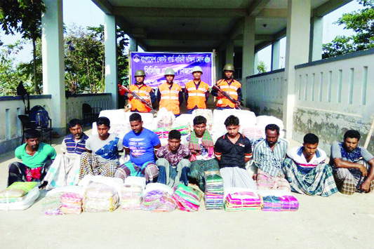 KUAKATA (Patuakhali) : Members of Coast Guard arrested ten robbers with Indian sarees from Kuakata on Thursday.