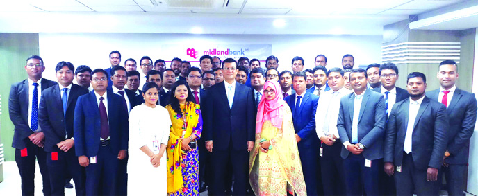 Md. Ahsan-uz Zaman, Managing Director and CEO of Midland Bank Ltd, poses for photo session with the percipients of a 5-daylong Sixth Batch Foundation Training Programme for its officials at its Training Institute at Gulshan in the city recently. Officials