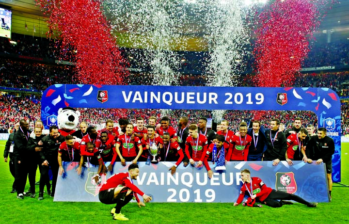 Team of Rennes celebrate with trophy after winning the French Cup soccer final between Rennes and Paris Saint Germain at the Stade de France stadium in Saint-Denis, outside Paris, France on Saturday.