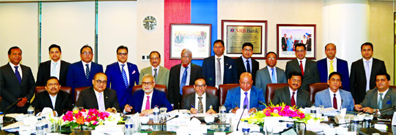 Mohammed Mahtabur Rahman, Chairman of NRB Bank Limited, signing the Accounts and Balance Sheet of the bank for the year ended 2018 approved in the board meeting at its office in the city on Sunday. M Badiuzzaman, EC Chairman, Imtiaz Ahmed, Audit Committee