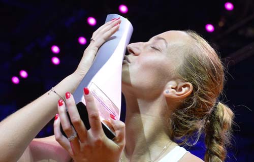 Czech Republic's Petra Kvitova kisses the trophy as she celebrates victory over Estonia's Anett Kontaveit in their final match at the WTA Tennis Grand Prix in Stuttgart, southwestern Germany on Sunday.