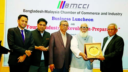 BMCCI President Syed Moazzem Hossain, handing over a crest to Salman F. Rahman, Private Industry and Investment Affairs Adviser to Prime Minister Sheikh Hasina at BMCCI Business luncheon programme on Fourth Industrial Revolution- Preparation at a city ho