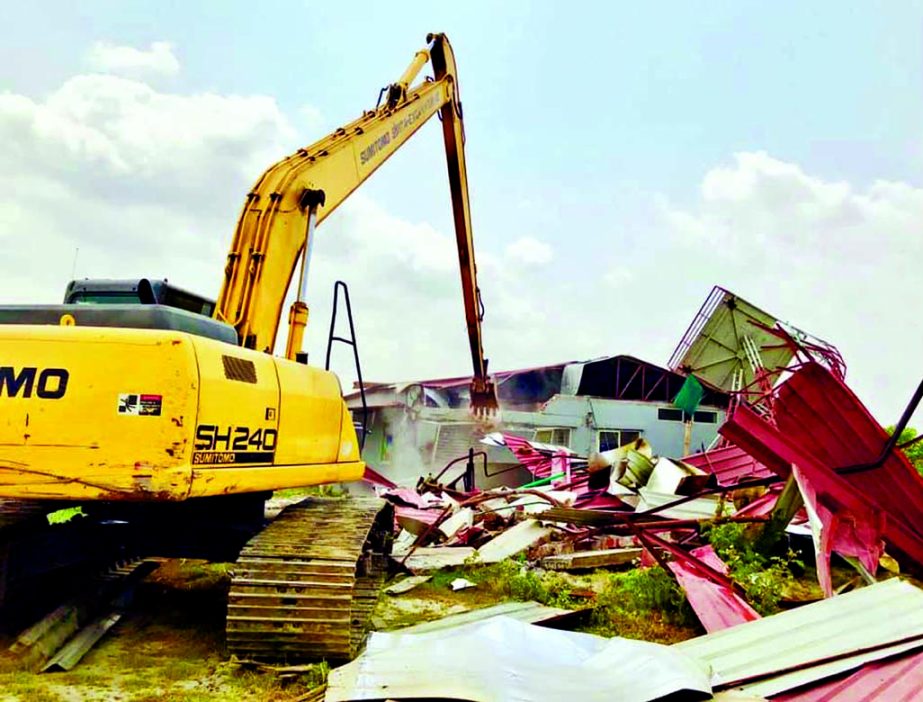 BIWTA evicting illegal installations from the bank of Balu River as part of continuous drive. This photo was taken from the Ishapura Bazar point on Tuesday.