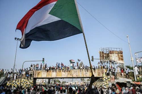 Sudanese protesters chant slogans during a sit-in outside the army headquarters in the capital Khartoum on Wednesday.