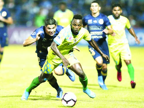 Wilson Cuero (right) of Venezuela's Mineros fights for the ball with Ivan Villalba of Paraguay's Sol de America during a Copa Sudamericana soccer game, in Asuncion, Paraguay on Wednesday.