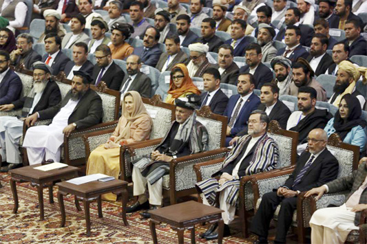 Afghan President Ashraf Ghani, (centre), attends the last day of the Afghan Loya Jirga meeting in Kabul, Afghanistan on Friday.