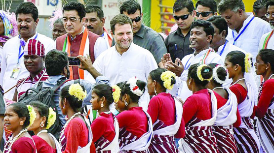 Congress president Rahul Gandhi is welcomed by tribals during a rally for in Simdega district of Jharkhand on Thursday.