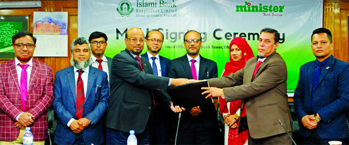 Mohammed Monirul Moula, AMD of Islami Bank Bangladesh Limited and Dilruba Tanu, Managing Director of Minister Hi-Tech Park Limited, exchanging a MoU signing document at the Banks head office in the city recently. Under the deal, VISA Debit & Khidmah cardh
