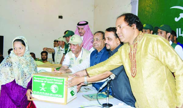 Taha Omar Alkhateeb , Director General of Programme and Welfare , International Organization for Relief, Welfare and Development along with Chief Guest former State Minister for Railway Mujibul Haq MP and special guests distributing Iftar items among dis