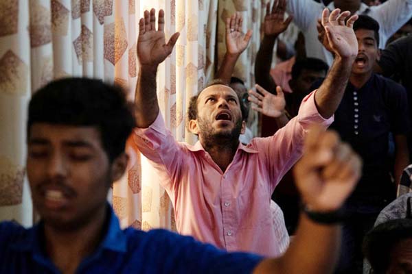 Members of Zion Church, which was bombed on Easter Sunday, pray at a community hall in Batticaloa, Sri Lanka on Sunday. AP photo