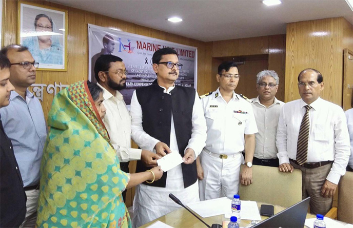 State Minister for Shipping Khalid Mahmud Chowdhury, handing over a compensation cheque to the family of Md Ali Ajgor, Deck Cadet killed in accident at the Ministry on Sunday.