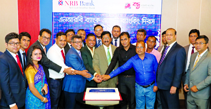 Md. Mehmood Husain, Managing Director of NRB Bank Limited, celebrating its 1stAgent Banking Day programme at its head office in the city on Monday. Imran Ahmed, Chief Operating Officer, Mohd. Jamil Hossain, Head of CRM, Imteeaz Ahmed, Head of Human Resour