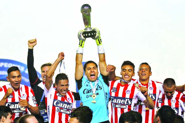 Atletico San Luis' goalkeeper Carlos Rodriguez lifts the trophy of Mexico's second division soccer league after defeating Dorados in San Luis Potosi, Mexico on Sunday. Atletico San Luis won promotion to the Mexican first division soccer league.