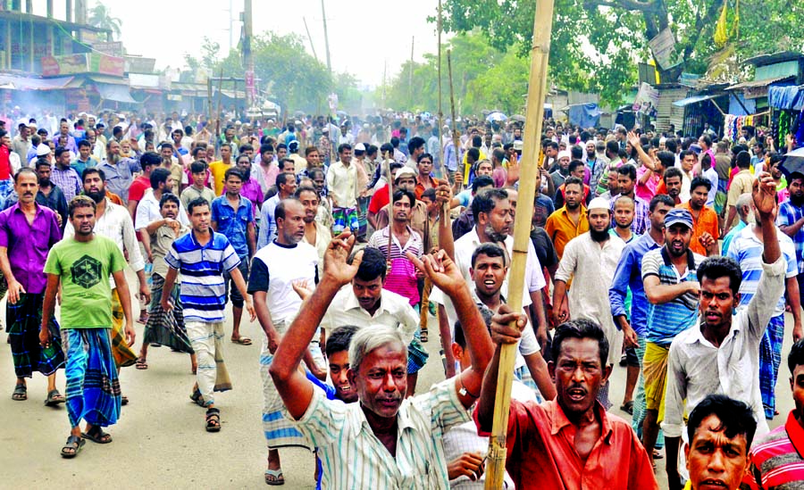 Agitating jute mill workers staged demonstration in Demra Staff Quarter on Monday demanding implementation of 9-point charter of demands.