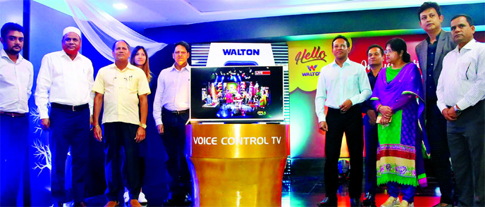 Chairman of Walton Hi-Tech Industries Limited SM Nurul Alam Rezvi, Managing Director SM Ashraful Alam and Directors SM Mahbubul Alam and Risa Sigma Hima, inaugurating the new technology-run Bangla Voice Control Smart TV at its corporate office on Monday.
