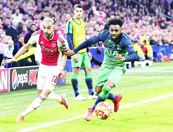 Ajax's Hakim Ziyech (left) duels for the ball with Tottenham's Danny Rose during the Champions League semifinal second leg soccer match between Ajax and Tottenham Hotspur at the Johan Cruyff ArenA in Amsterdam, Netherlands on Wednesday.